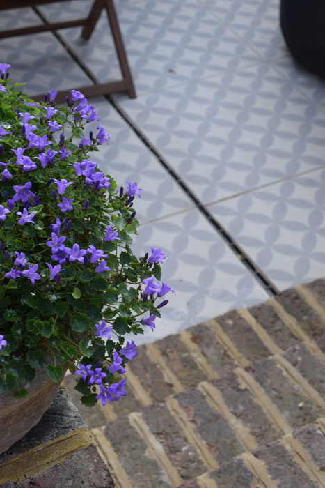 Patterned porcelain paving in courtyard